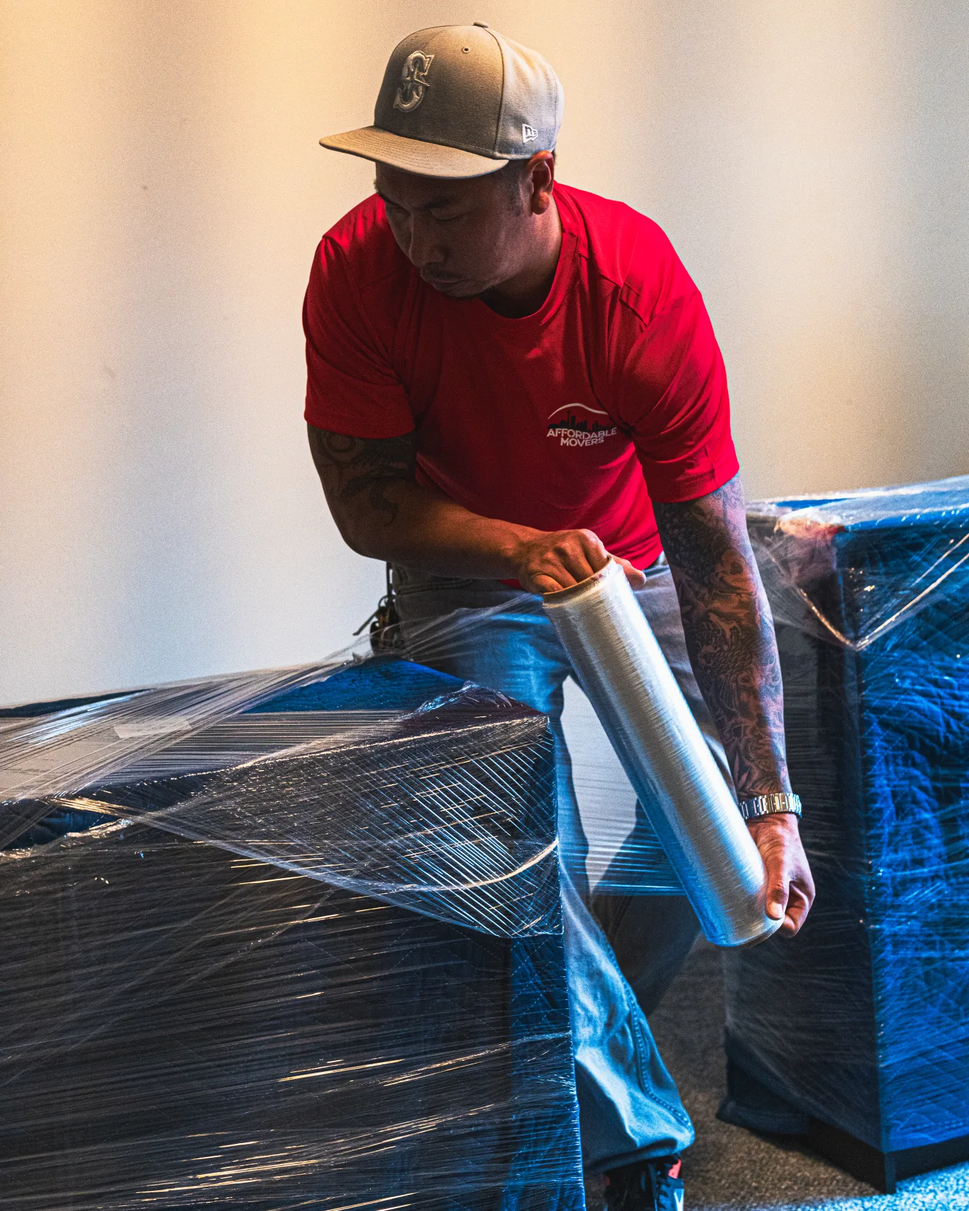 Affordable Movers team member wrapping furniture for a safe move.