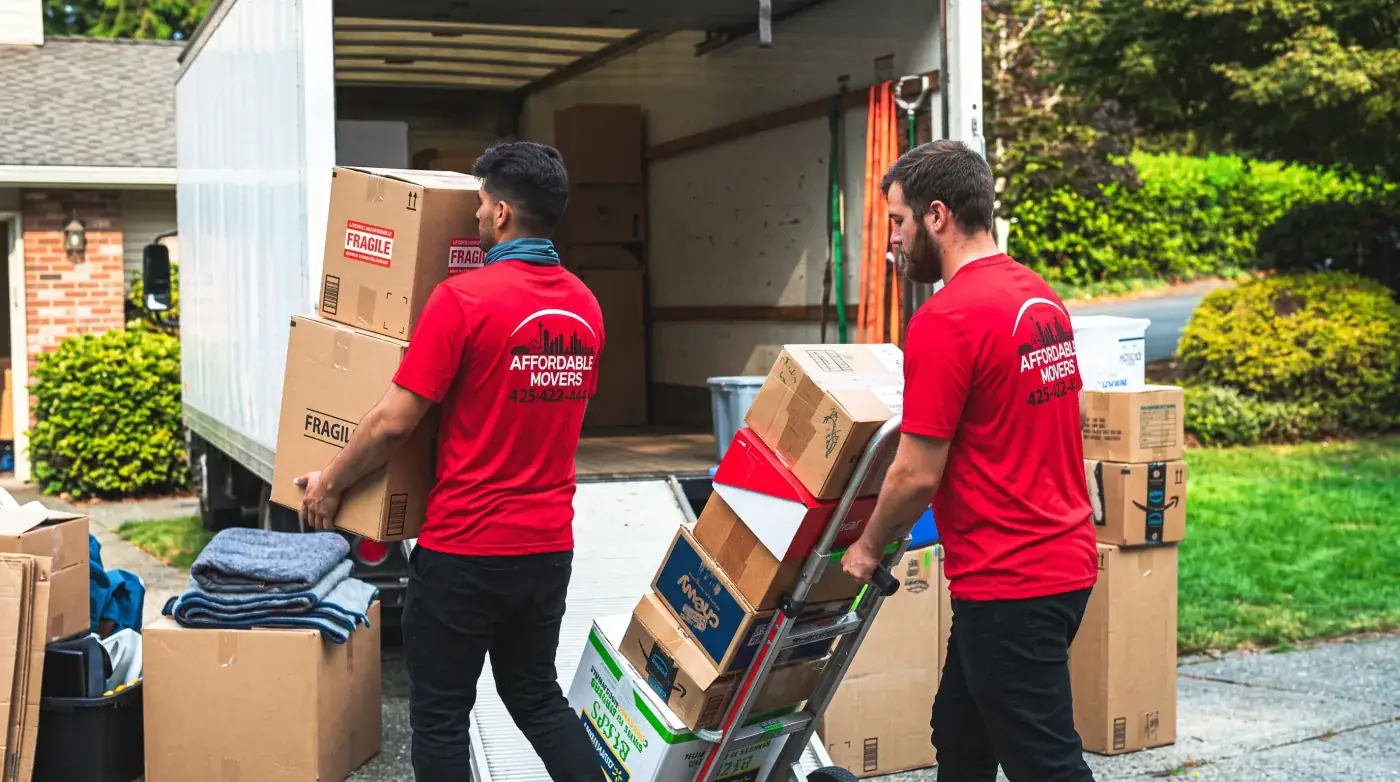 Affordable Movers crew loading boxes into a moving truck.